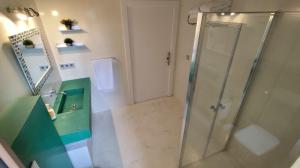 a bathroom with a shower and a sink at House La parada in Nava, Villa de la Sidra in Nava +11 photos