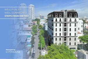 a view of a city street with buildings at CityHouse - Atelier Thảo Điền in Ho Chi Minh City