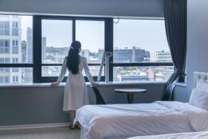 Postel nebo postele na pokoji v ubytování Hotel Wooin