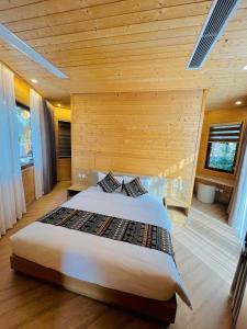 Un ou plusieurs lits dans un hébergement de l'établissement Yasumi Onsen Resort