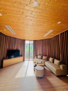 Télévision ou salle de divertissement dans l'établissement Yasumi Onsen Resort 49 autres photos