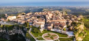 an aerial view of a village on a mountain at La luna nel pozzo in Gerace