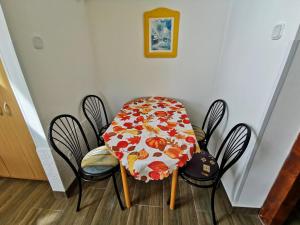a table and chairs with a table cloth on it at Napospart 33 in Balatonlelle +4 photos