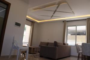 a living room with a couch and a table at Amaretraouf عماره رؤوف 