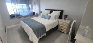 Postel nebo postele na pokoji v ubytování Coastal Beach Escape + 13 fotografií