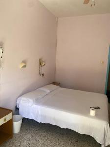 Postel nebo postele na pokoji v ubytování HOTEL Donati