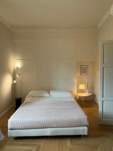 a bedroom with a large bed in a room at Porto Sole Rooms in Portoferraio