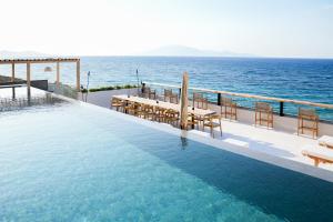 a swimming pool with a view of the ocean at Callisto Azzure in Zakynthos Town