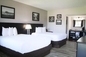 Voodi või voodid majutusasutuse La Quinta Inn by Wyndham Cocoa Beach-Port Canaveral toas