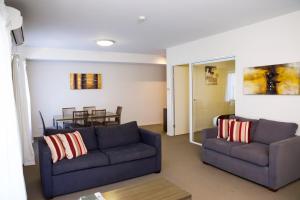 a living room filled with furniture and a couch at Quest Shepparton in Shepparton