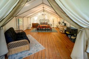 a living room with a tent with a table at Idyllic Copperhill Rental Perfect for a Weekend Getaway in Tennessee in Copperhill