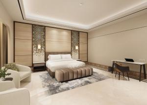 a bedroom with a bed and a desk at Lotusa Batulicin by Swiss-Belhotel in Mantaak +67 photos