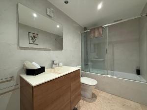 a bathroom with a sink and a toilet and a shower at 18 Torres Santa Cruz in Zaragoza +13 photos