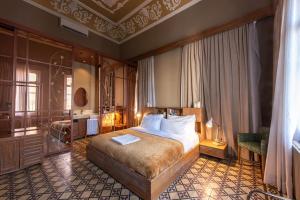 a bedroom with a king sized bed in a room at Hotel Lost Gemmayzeh in Beirut