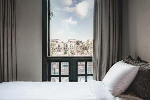 Cama ou camas em um quarto em Cook’s Club El Gouna (Adults Only)