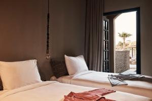Cama ou camas em um quarto em Cook’s Club El Gouna (Adults Only)