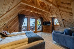 Postel nebo postele na pokoji v ubytování Domki Tatra Loft