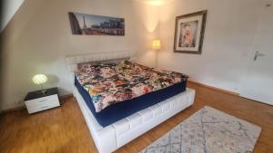 a bedroom with a bed with a quilt on it at Blue-Lake View in Geneva