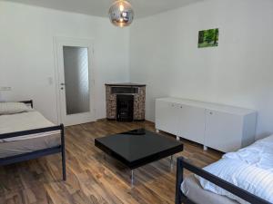 a living room with a bed and a coffee table at Apartment in Schottwien