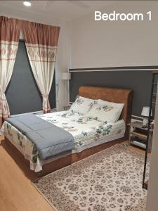 a bedroom with a bed and a rug at 2H mayabay homestay splashmania gamuda cove Klia in Banting