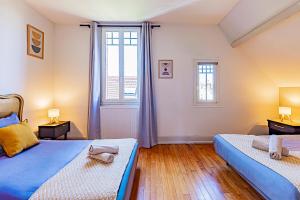 Ένα ή περισσότερα κρεβάτια σε δωμάτιο στο Maladière la Belle 6p
