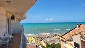 a view of the beach from the balcony of a building at Soleil Summer Apartments in Golem