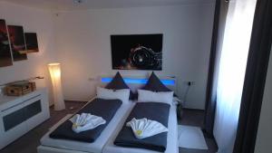 a bedroom with a bed with two pillows at Modern Flat in Radolfzell am Bodensee