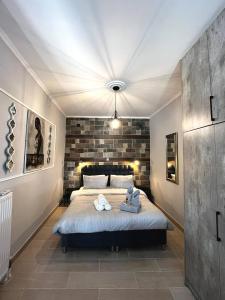 a bedroom with a bed with towels on it at Artistic Escape in Vasilikí