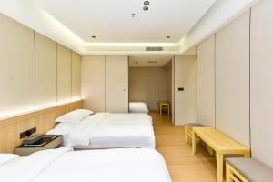 Postel nebo postele na pokoji v ubytování 金江西北大酒店 + 102 fotografií