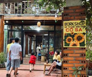 a group of people walking in front of a store at Cô Ba Homestay Măng Đen in Kon Von Kla +25 photos