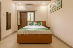Katil atau katil-katil dalam bilik di Treebo Raj Palace