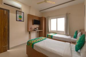 Katil atau katil-katil dalam bilik di Treebo Raj Palace