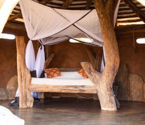 Katil atau katil-katil dalam bilik di Tassia Community Lodge