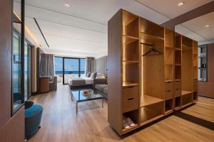 a living room with a couch and a table at Amathus Beach Hotel Limassol in Limassol