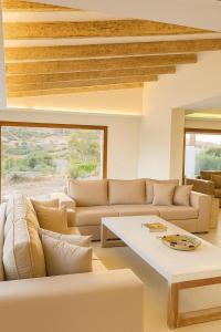 a living room with a couch and a table at Villa Jasmin 12 in M'diq