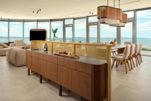 a kitchen and living room with a view of the ocean at Radisson Blu Resort & Spa in Split
