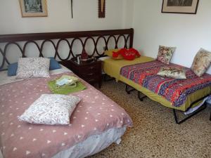 a bedroom with two beds with pillows on them at Holiday home in Santa Cruz de Tenerife +64 photos