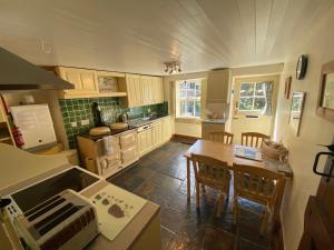 Kuchyň nebo kuchyňský kout v ubytování Candlelight Cottage - Litton