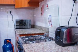 Kuchyň nebo kuchyňský kout v ubytování KAREN Comfort 3BR Holiday Home Nandi Rd off Miotoni