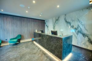 TV a/nebo společenská místnost v ubytování ASTE hotel