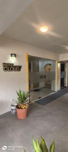 a lobby with a hotel group sign on the wall at Hotel Cloud 7 in Ahmedabad