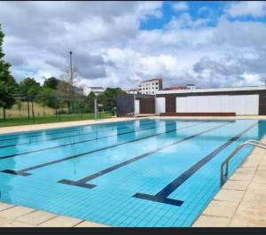a large swimming pool on top of a building at Real 49 camiño Santiago in Neda