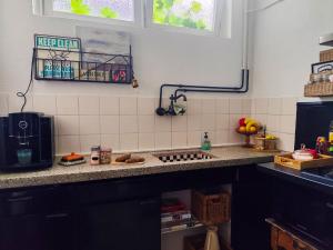 a kitchen with a counter top with a stove top at Casa Elburg in Elburg +27 photos