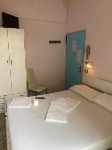 Postel nebo postele na pokoji v ubytování HOTEL Donati