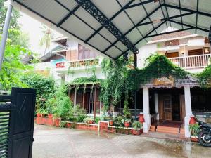 a building with plants on the side of it at ILLAM HERITAGE in Cochin