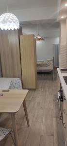 a living room with a table and a couch at Bio house posto auto aria condizionata in Bologna