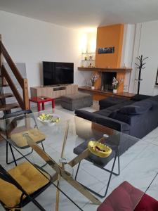 a living room with a couch and a table at Once Upon a Time in Centenaro