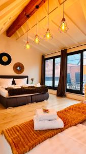 a bedroom with two beds and a rug at AMAO Green - City Center - Penthouse Maisonette - 90 m2 - 8 Guests - Rooftop Terrace - King-Size Beds in Lahr