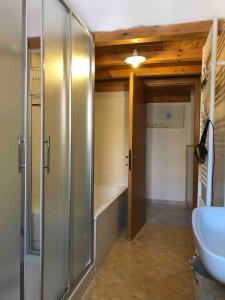 a bathroom with a shower and a sink and a tub at Villa Colonia in Campofilone +36 photos