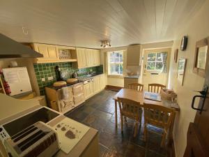 Kuchyň nebo kuchyňský kout v ubytování Candlelight Cottage - Litton